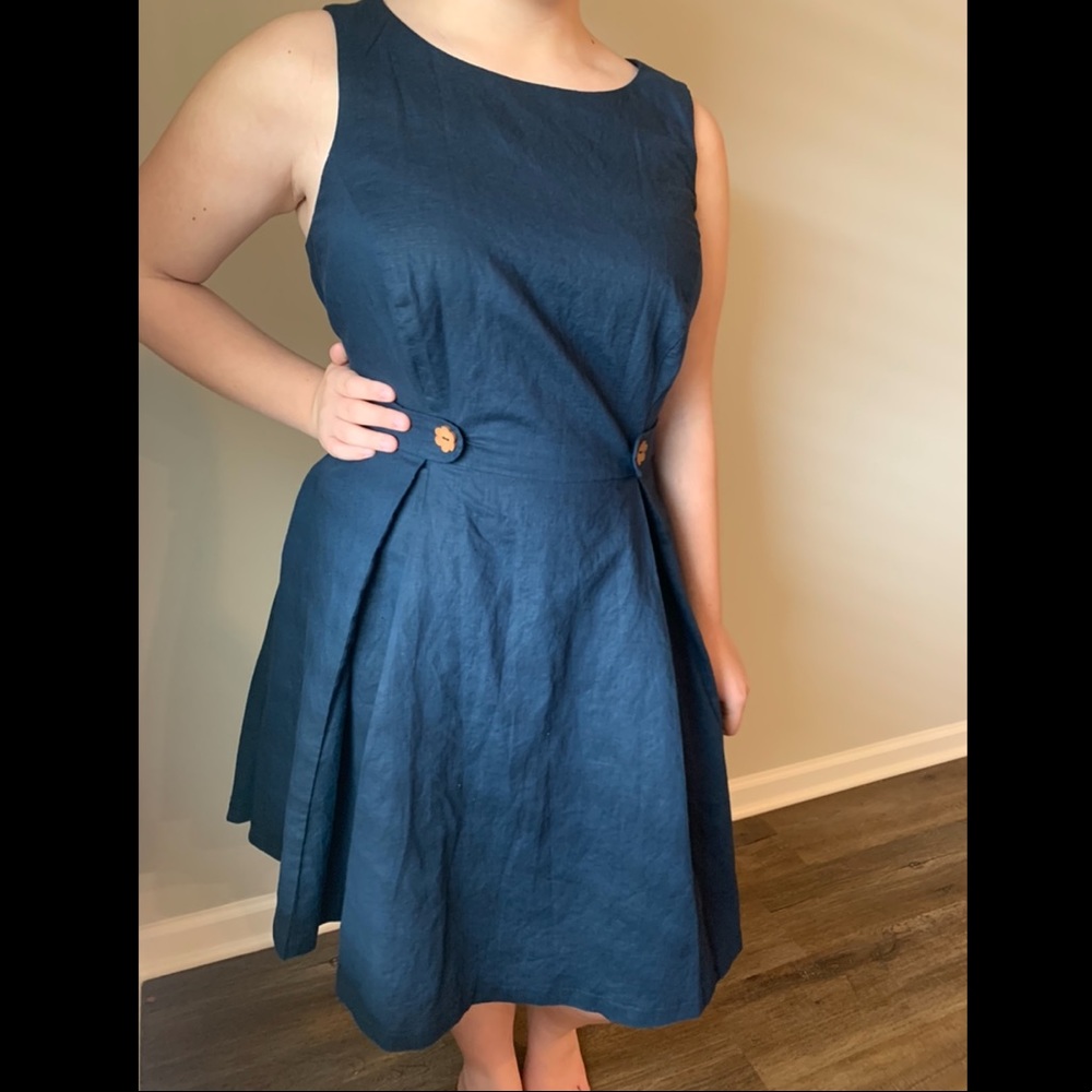 Navy fit and flare dress with wood flower buttons